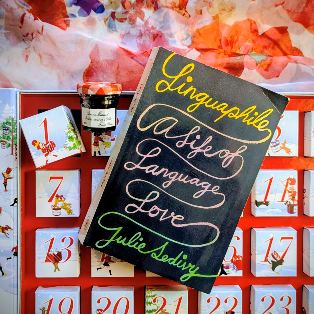 A copy of Julie Sedivy's book Linguaphile in front of an advent calendar.